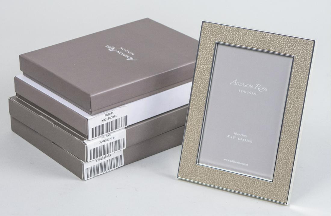 Group of Four Addison Ross Picture Frames: Including two sand shagreen 5 x 7 frames and two taupe enamel 5 x 7 frames, in original boxes. Notice to bidders: Due to the nature of this particular online sale, the lots offered may not be availabl
