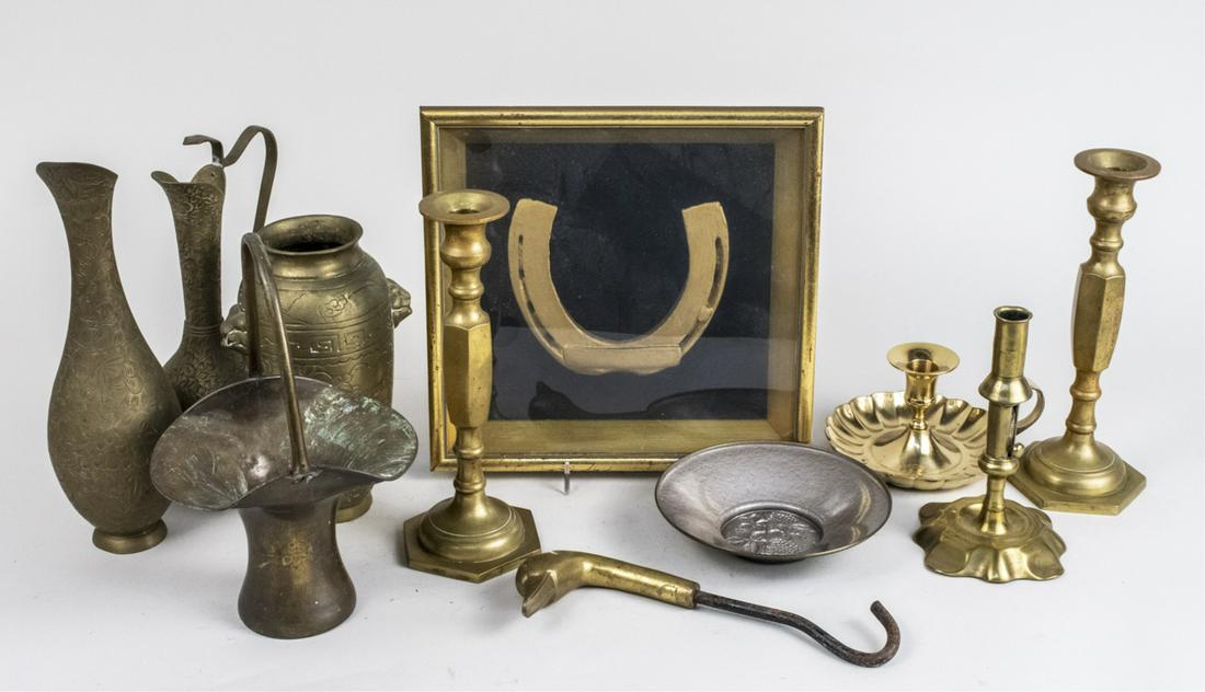 Group of Brass Decorations: Including candlesticks, vases, basket, framed horseshoe, etc. Tallest candlestick, height 12 inches. Notice to bidders: Due to the nature of this particular online sale, the lots offered may not be av