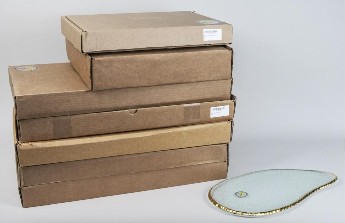 Annie Glass Edgey Pattern Serving Pieces: Seven assorted serving dishes, including three party trays, two rectangular trays, a cake stand, and a cheese plate, in original boxes. Notice to bidders: Due to the nature of this particular online s