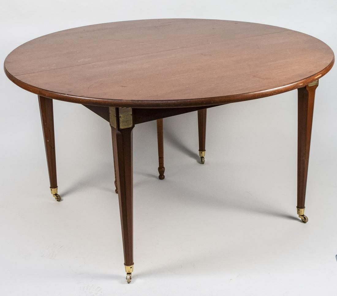 Neoclassical Style Extension Dining Room Table: Rectangular top with D shaped ends on tapered octagonal legs, gilt bronze panel inlay, on casters. Three large leaves and one short leaf. Height 30 inches, diameter 54 inches. Larger leaf width 54 inc