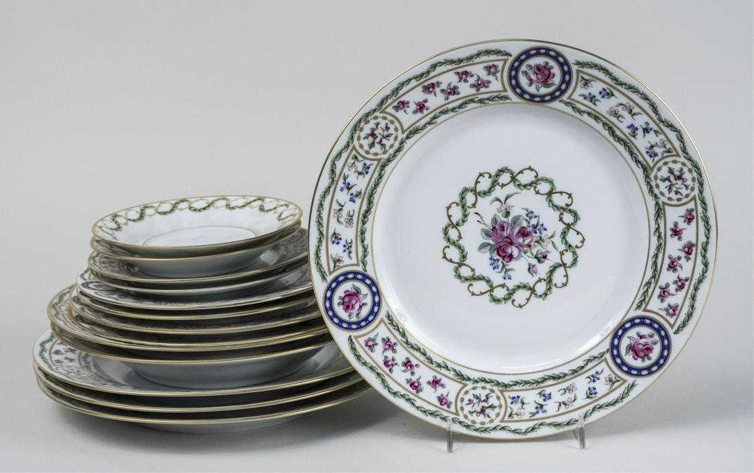 Haviland Limoges Porcelain Dinner Service: Approximately sixteen pieces, Louveciennes pattern, comprising four dinner plates, two salad plates, two dessert plates, two bread plates and two saucers. Dinner plate diameter 10 1/4 inches. Notice t