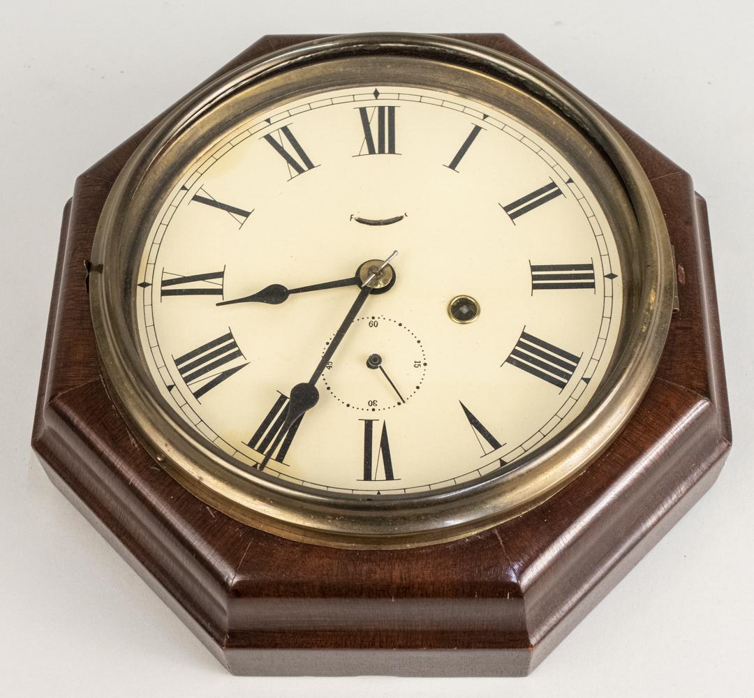 Seth Thomas Dial Clock: Octagonal case clock, dial with Roman numerals. Diameter 11 1/2 inches. Notice to bidders: Condition reports and additional photographs are provided by request as a courtesy to our clients, as such an