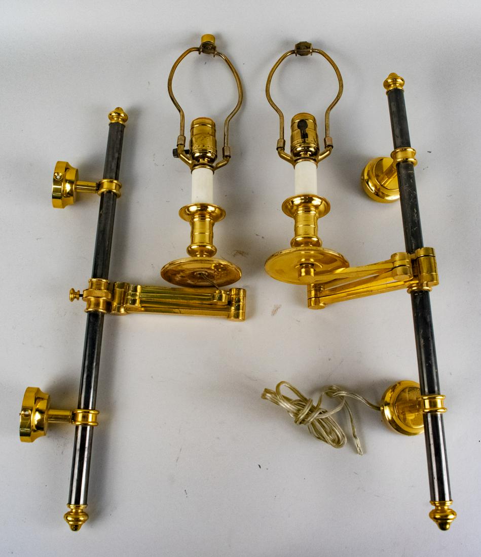 Pair of Brass Sconces: Partially ebonized, swing arm sconces. Height 24 inches. Notice to bidders: Condition reports and additional photographs are provided by request as a courtesy to our clients, as such any condition rep