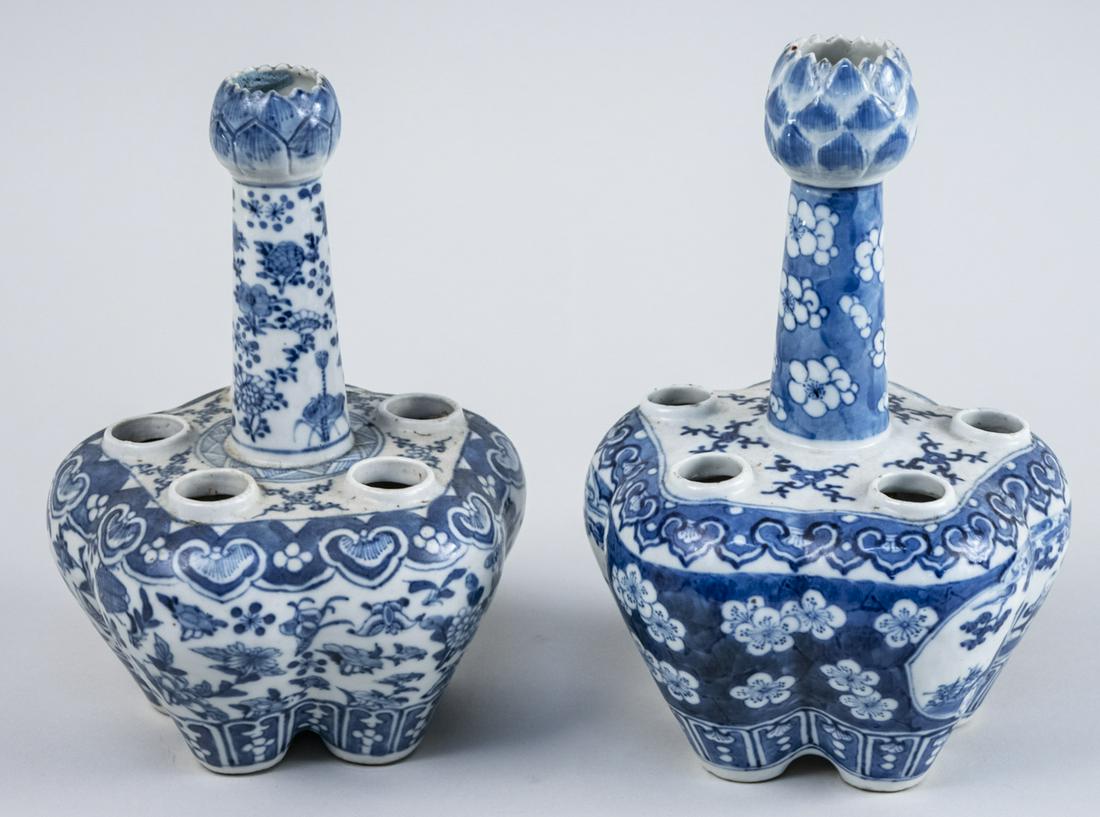 Two Chinese Blue and White Bulb Vases: 19th century, near pair with five openings and central lotus flower bulb topped shaft, decorated with flowers and vines. Height 10 inches. Notice to bidders: Condition reports and additional photograp