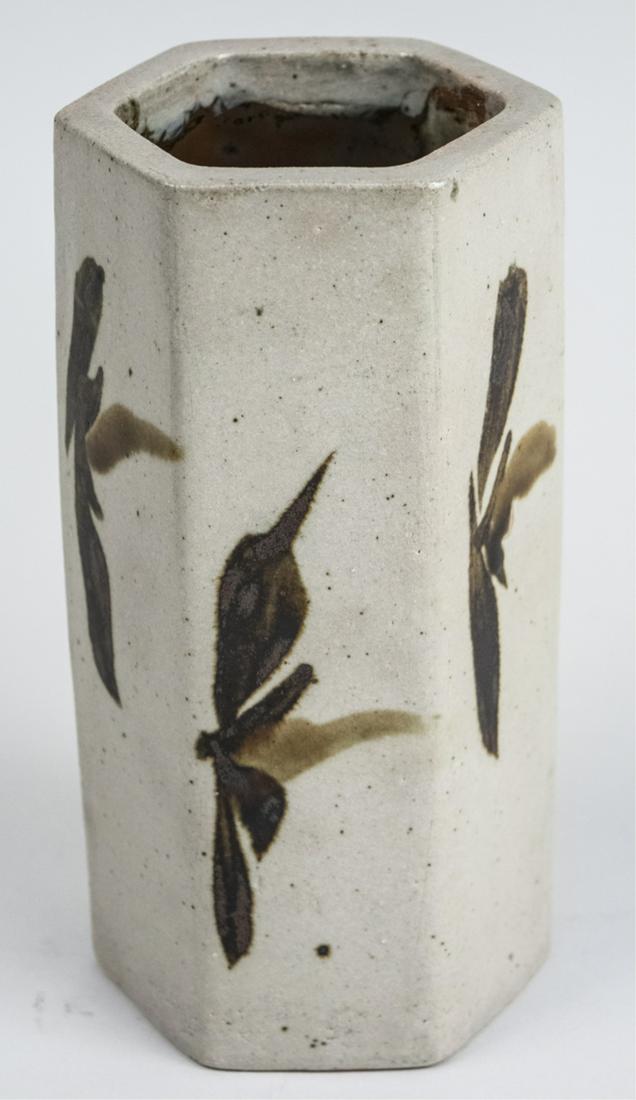 Shoji Hamada (Japanese) Pottery Vase: Hexagonal vase. (No box). Height 8 inches. Notice to bidders: Condition reports and additional photographs are provided by request as a courtesy to our clients, as such any condition report is only an