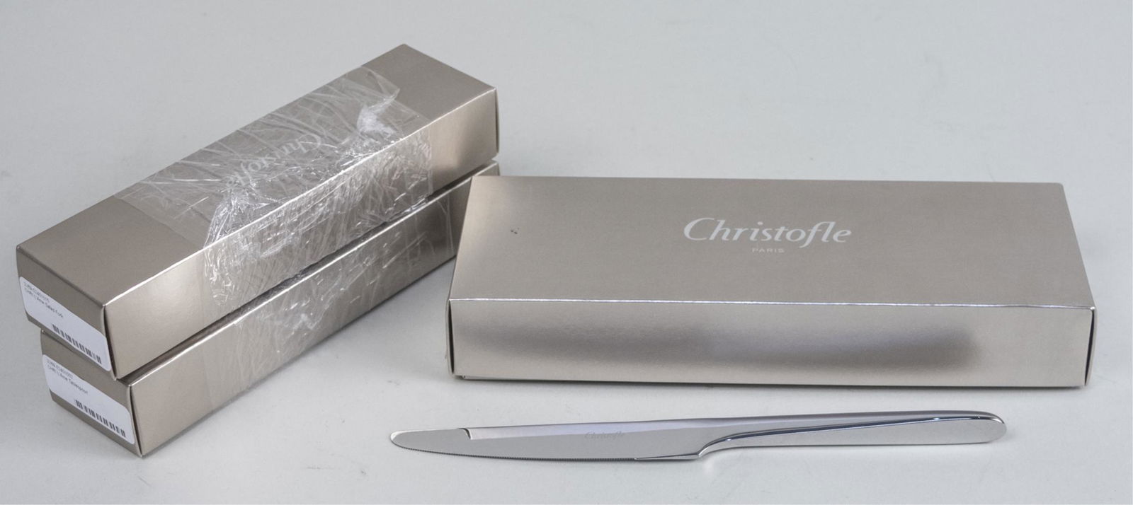 Christofle Lame Stainless Steel Flatware: Comprising a dinner knife, a dinner fork, a salad fork and a tablespoon. Notice to bidders: Due to the nature of this particular online sale, the lots offered may not be available for detailed conditi