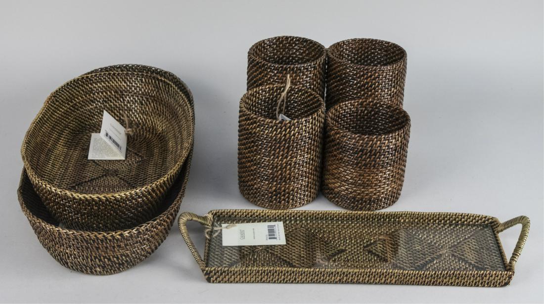 Group of Calaisio Wicker Table Decorations: Including two oval baskets, a wine caddy, and a rectangular tray with handles. Larger oval basket, 19 x 8 1/2 inches. Notice to bidders: Condition reports and additional photographs are provided by re