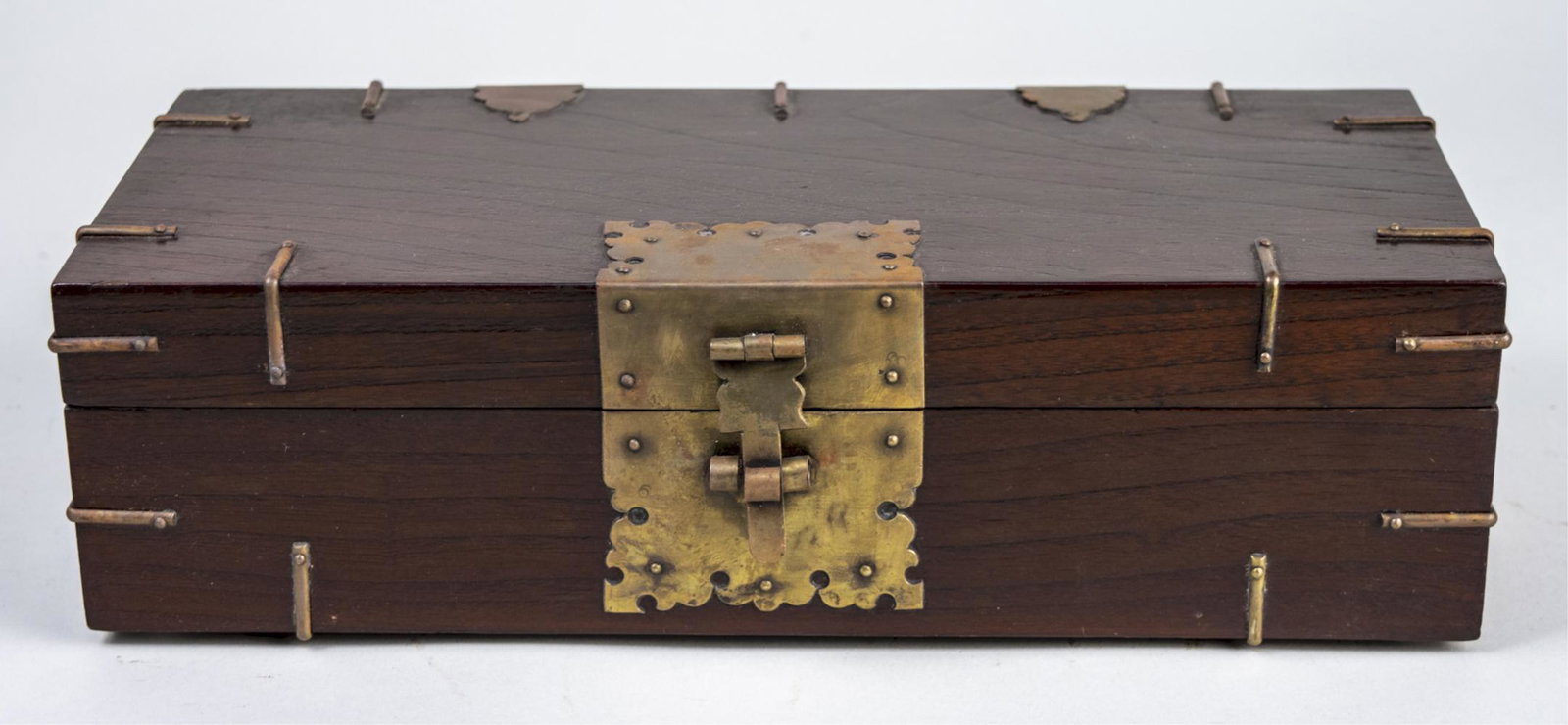 Korean Document Box: Brass bound rectangular box, opening to a fitted interior. Height 3 3/4 inches, width 13 inches, depth 6 inches. Notice to bidders: Due to the nature of this particular online sale, the lots offered m