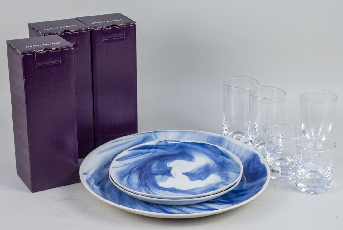 Simon Pearce Table Articles: Comprising a Marble Indigo platter and two dinner plates and two Hampton white wine glasses and a Hampton red wine glass, together with five clear glass glasses. Notice to bidders: Due to the nature o