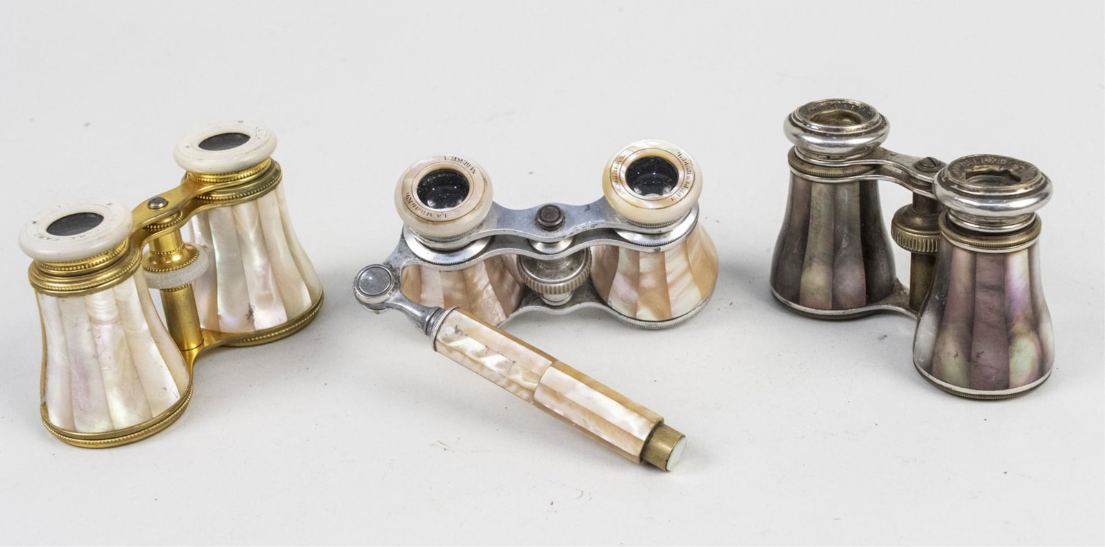Opera Glasses: Two mother of pearl glasses including one with a handel and an abalone pair. Notice to bidders: Condition reports and additional photographs are provided by request as a courtesy to our clients, as su