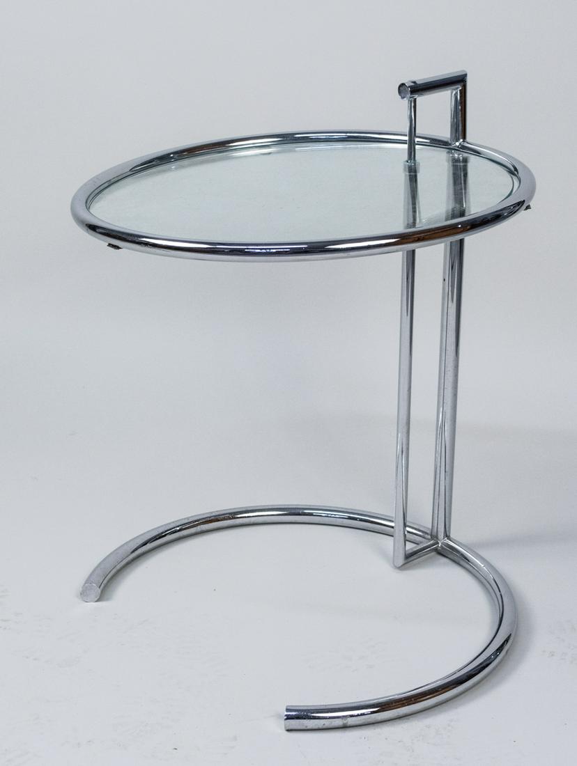 Eileen Gray End Table: Glass top circular side table. Height 22 inches, diameter 20 inches. Notice to bidders: Condition reports and additional photographs are provided by request as a courtesy to our clients, as such any c