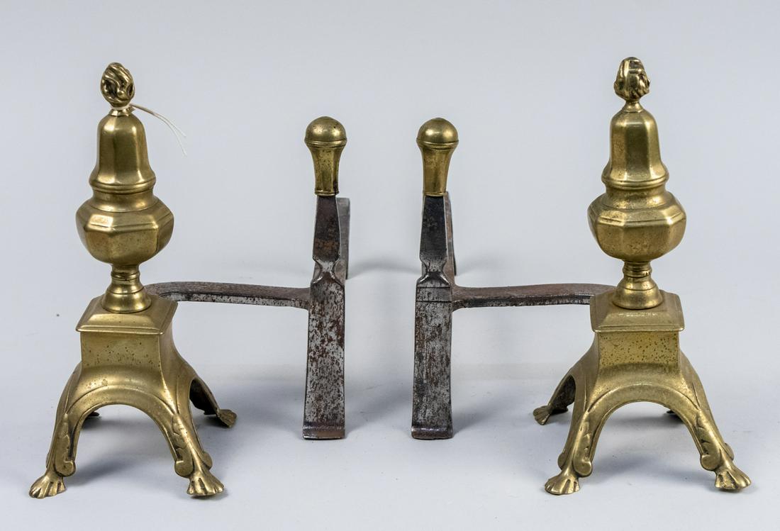 Pair of Brass Andirons: With faceted urn form finials. Height 10 5/8 inches. Notice to bidders: Condition reports and additional photographs are provided by request as a courtesy to our clients, as such any condition report 