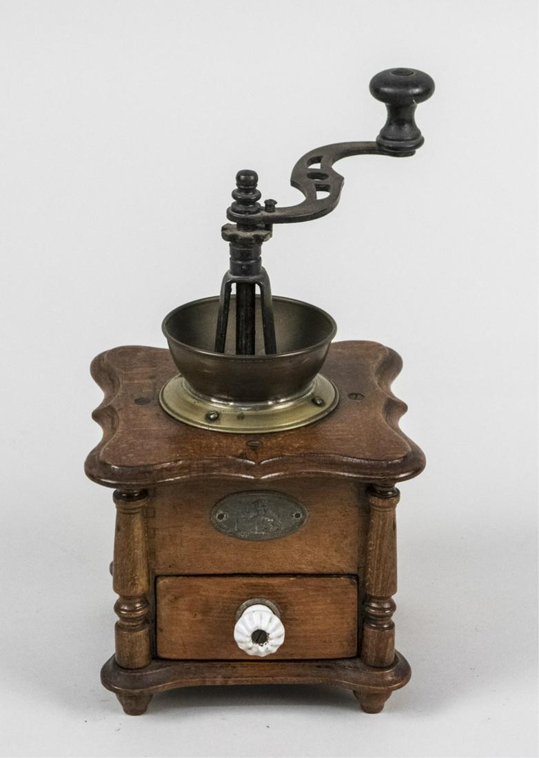 Vintage Coffee Mill: Of typical form. Notice to bidders: Condition reports and additional photographs are provided by request as a courtesy to our clients, as such any condition report is only an opinion and should not be