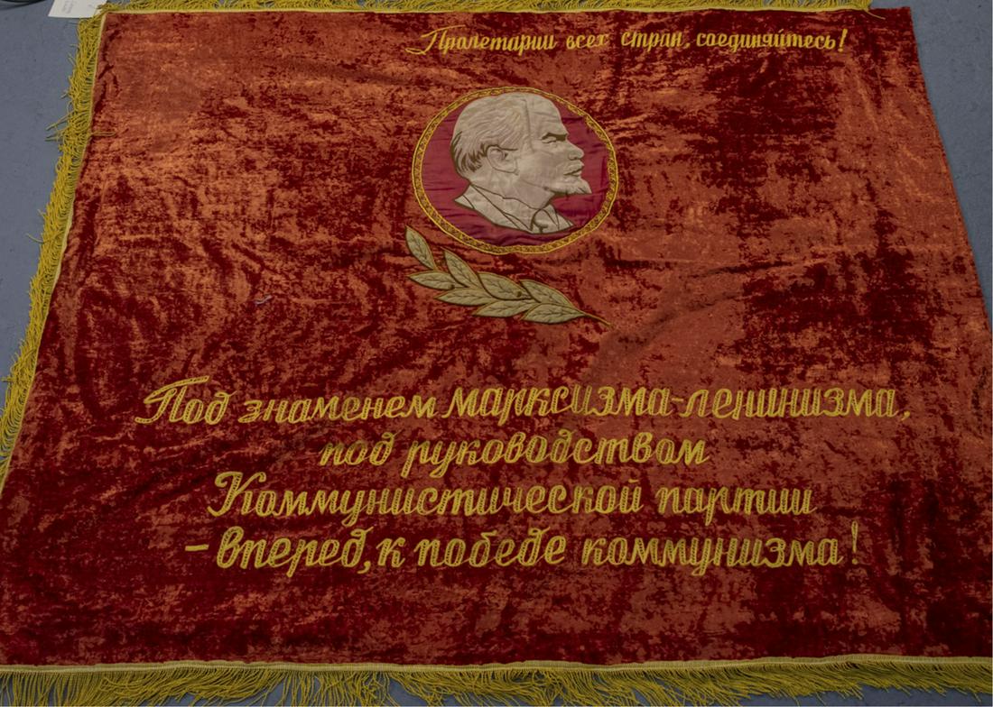 Soviet Velvet Wall Hanging: Red velvet throw / wall hanging, one side with a picture of Vladimir Lenin, the other, a hammer and sickle. 52 x 64 inches. Notice to bidders: Condition reports and additional photographs are provided