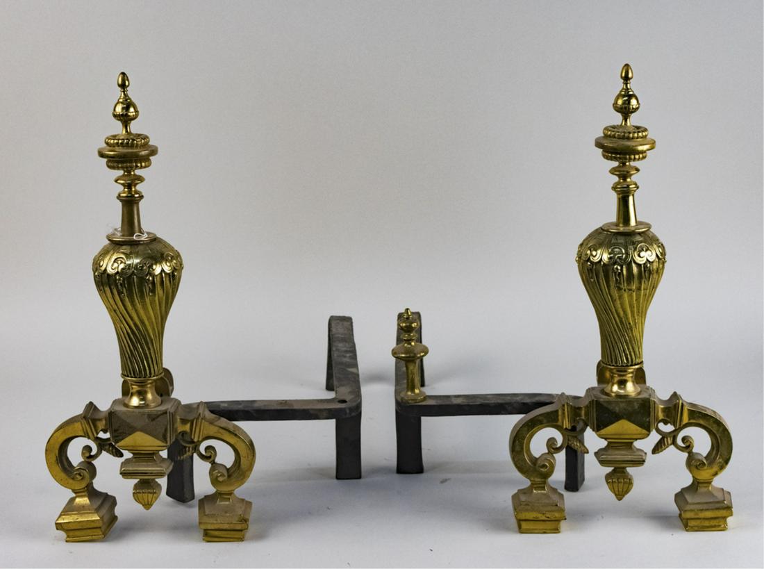 Pair of Brass Andirons: Inverted baluster and turned finial decoration. Height 18 inches. Notice to bidders: Due to the nature of this particular online sale, the lots offered may not be available for detailed condition repo