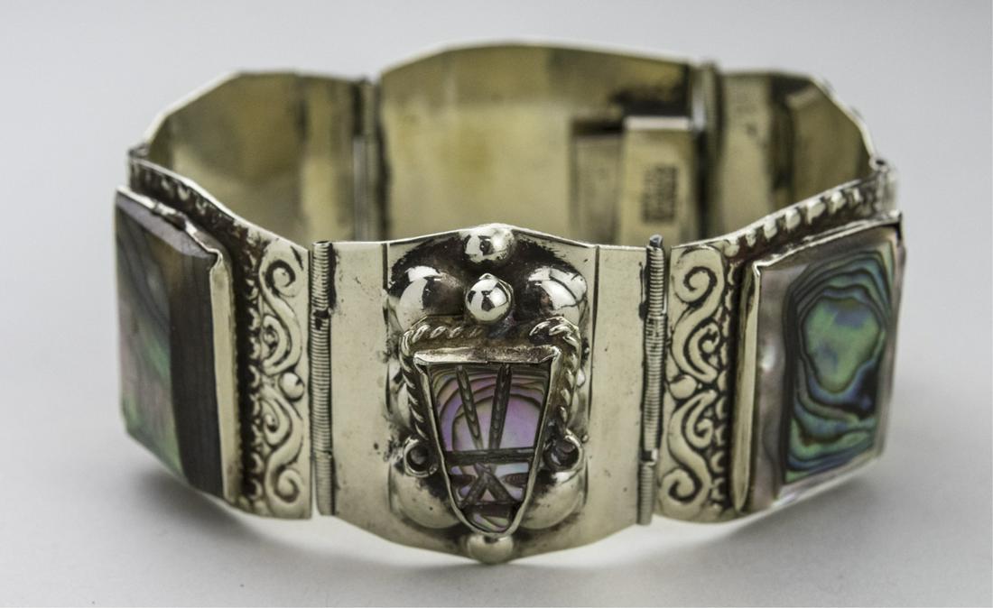 Mexican Sterling Silver & Abalone Bracelet: Six box links, each set with an abalone shell. marked Mexico and 925. Length 7 inches. Notice to bidders: Condition reports and additional photographs are provided by request as a courtesy to our clie