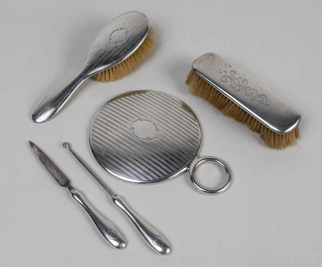 Gorham Sterling Silver Assembled Dresser Set *: Five pieces including a hand mirror, hair brush, clothes brush, file and button pull. Notice to bidders: Due to the nature of this particular online sale, the lots offered may not be available for det