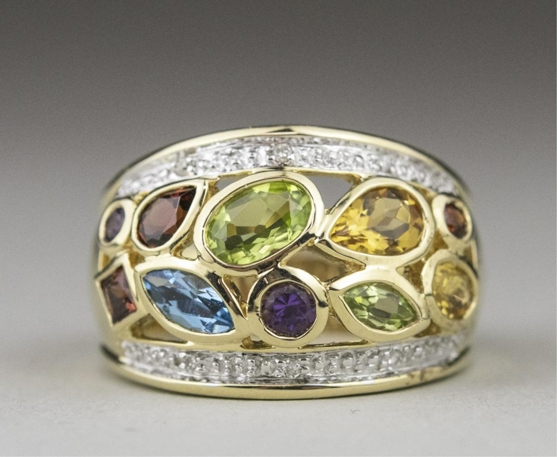 Gemstone Ring *: 14k yellow gold ring set with faceted blue topaz, peridot and garnets in assorted cuts, within a row of diamonds. Size 7, 8.0 grams. Notice to bidders: Due to the nature of this particular online sale