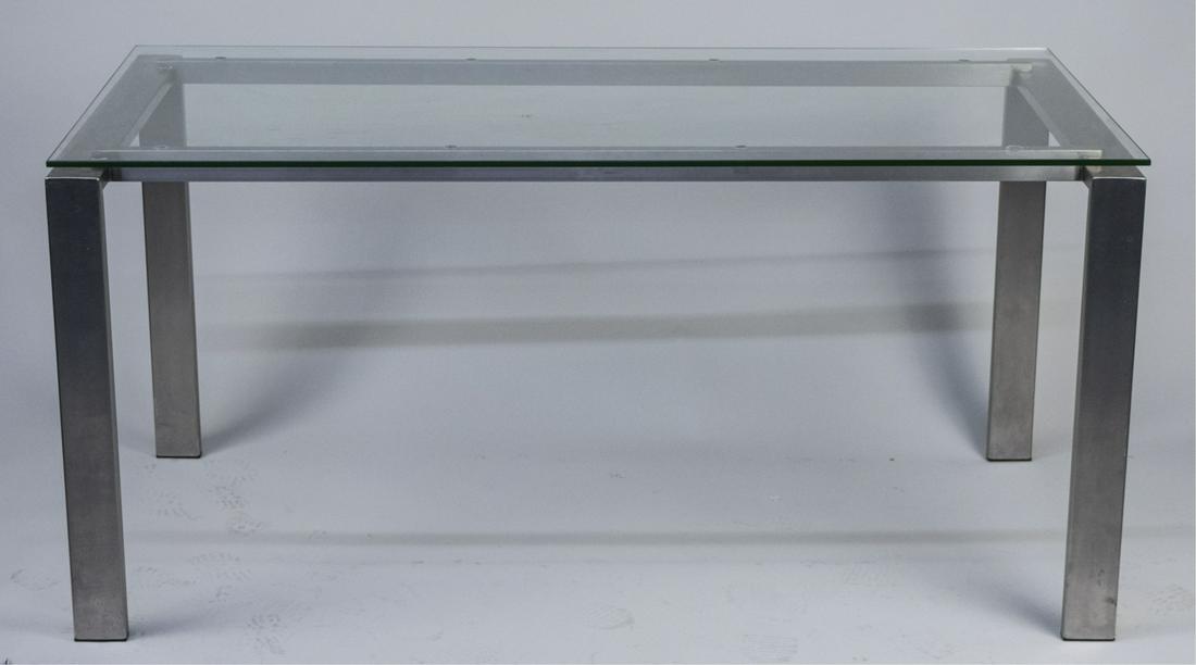 Contemporary Glass Top Executive Desk: Rectangular glass top on a brushed metal base. Height 29 inches, width 60 inches, depth 30 inches. Notice to bidders: Due to the nature of this particular online sale, the lots offered may not be avai