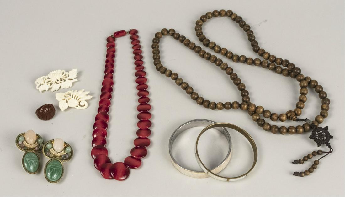 Group of Costume Jewelry: Two simulated mother of pearl bangles, a red flat bead necklace, a wood bead necklace and ring, two simulated ivory pins and a pair of vintage earrings signed Hansen 88. Notice to bidders: Condition r
