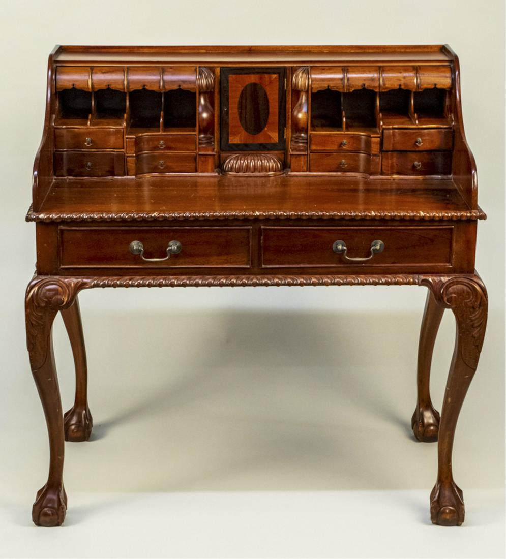 Fruitwood Desk: Rectangular top over a fitted interior. Height 42 inches, width 40 inches, depth 24 inches. Notice to bidders: Condition reports and additional photographs are provided by request as a courtesy to our