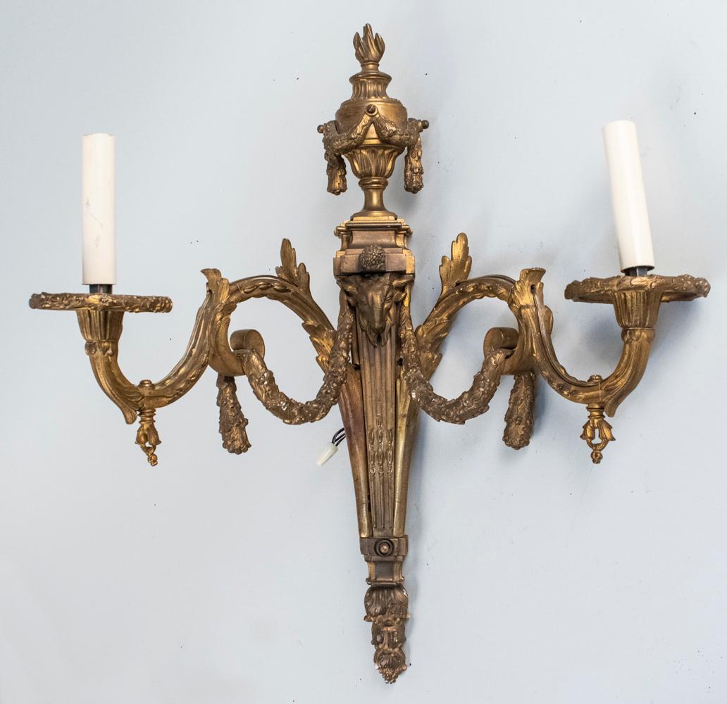 Bronze Sconce: Neoclassical style two light sconce with scroll and acanthus leaf decoration. Height 22 inches. Notice to bidders: Condition reports and additional photographs are provided by request as a courtesy to