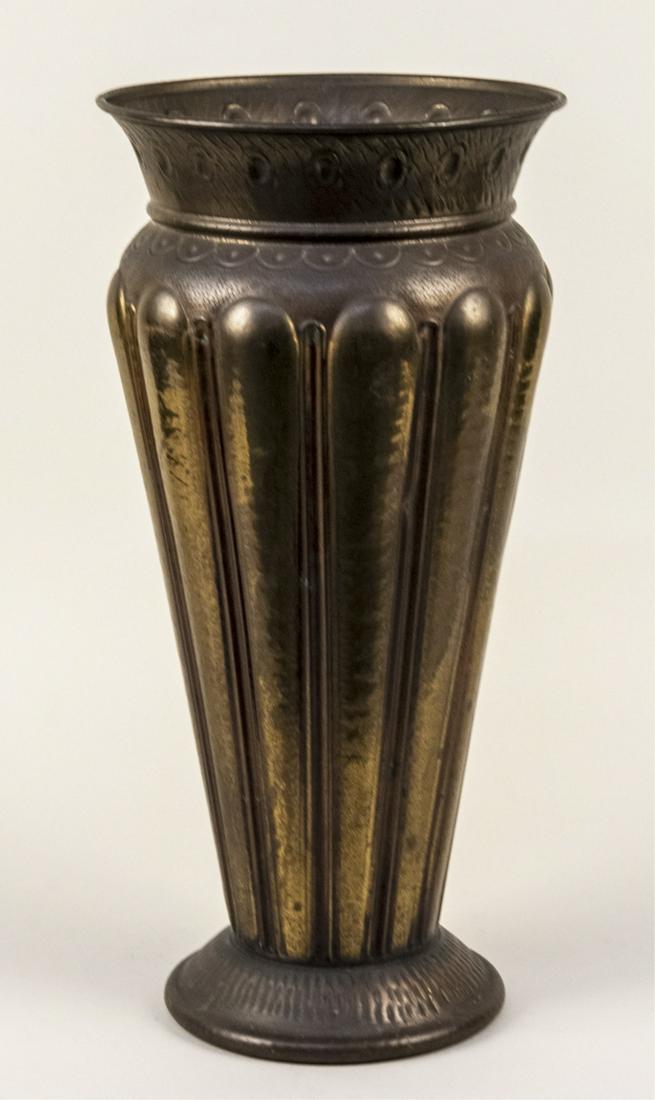 Brass Umbrella Stand: Reeded tapered body with waisted neck, flared rim, and spread foot. Height 20 inches. Notice to bidders: Condition reports and additional photographs are provided by request as a courtesy to our clien