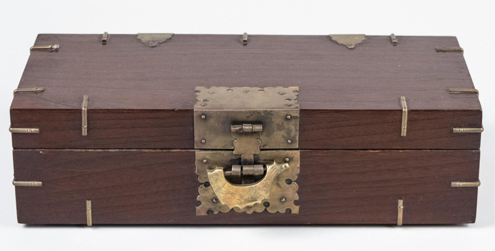 Korean Document Box: Rectangular, brass bound wood box. Height 3 3/4 inches, length 13 inches, depth 6 inches. Notice to bidders: Due to the nature of this particular online sale, the lots offered may not be available for