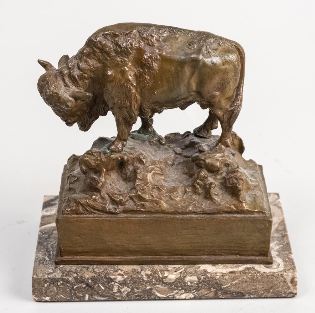 Carl Kauba (Austrian 1865-1922) Bronze Figure: Bronze desk ornament figure of a buffalo, signed C Kauba at the base, mounted on a marble base. Height 6 1/4 inches. Notice to bidders: Due to the nature of this particular online sale, the lots offer