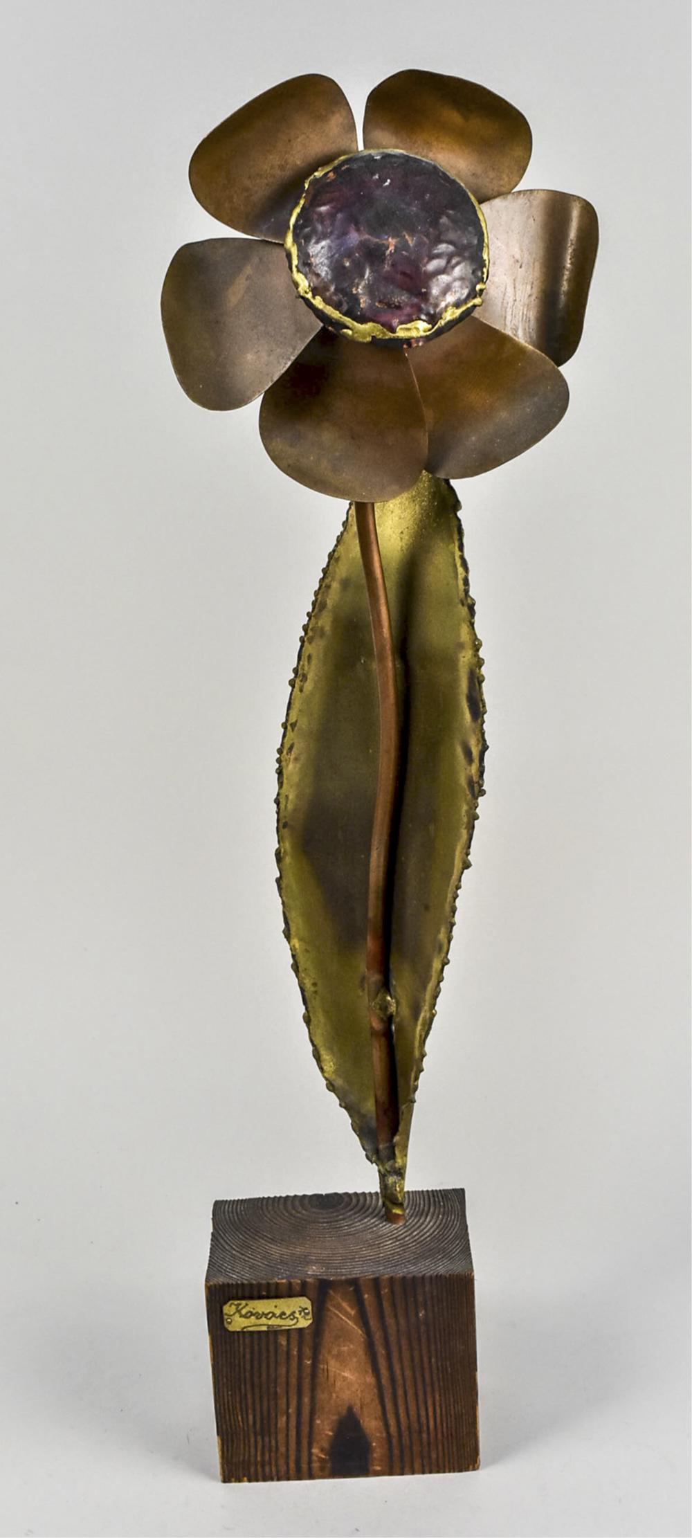 Alex Kovacs Metal Flower Sculpture: Patinated metal single flower, signed on the base. Height 23 inches, overall 27 inches. Notice to bidders: Condition reports and additional photographs are provided by request as a courtesy to our cli