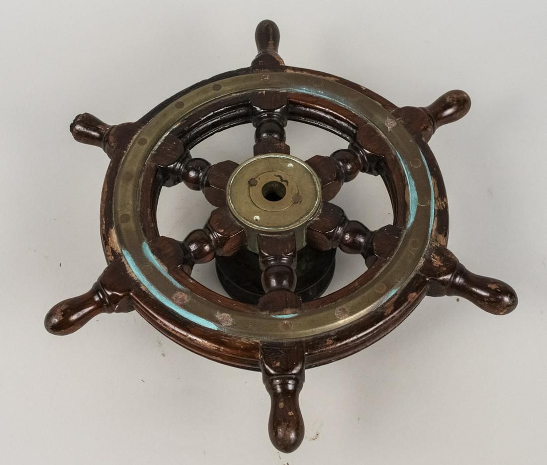 Small Ships Wheel: Diameter 16 inches. Notice to bidders: Condition reports and additional photographs are provided by request as a courtesy to our clients, as such any condition report is only an opinion and should not