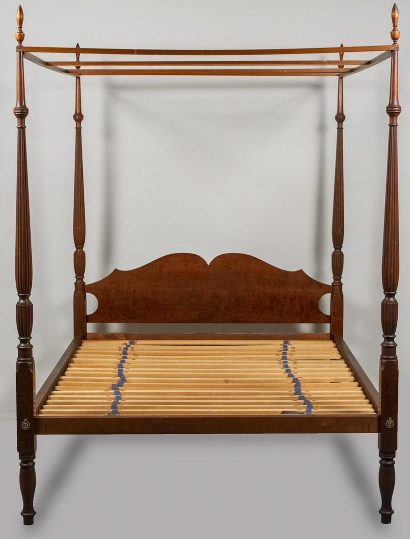 Eldred Wheeler Sheraton Style Four Post Canopy Bed: Cherry finish, with serpentine headboard, turned and reeded posts, complete with original slats. Overall height 89 inches, width 65 1/2 inches, depth 86 inches, inside width 61 inches, depth 80 inches