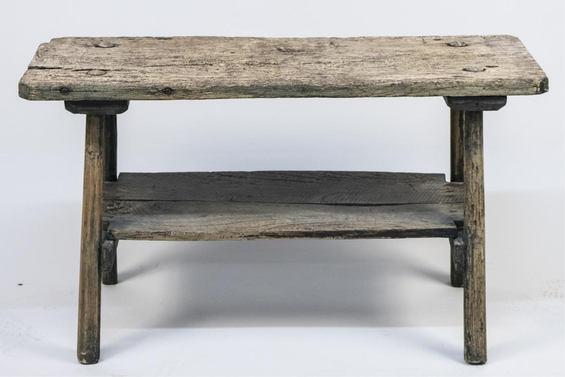 Primitive Work Table: Rectangular top on block legs joined by a medial shelf. Height 25 inches, width 43 inches, depth 16 inches. Notice to bidders: Condition reports and additional photographs are provided by request as a