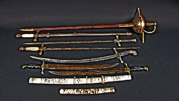 Miscellaneous Assorted Group of Nine Edged Weapons: Including swords and rapiers and a Japanese tanto.