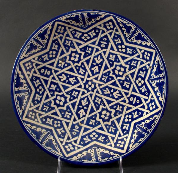 Middle Eastern Porcelain Charger: Early 20th century, blue and white geometric decoration. Diameter 13 inches.