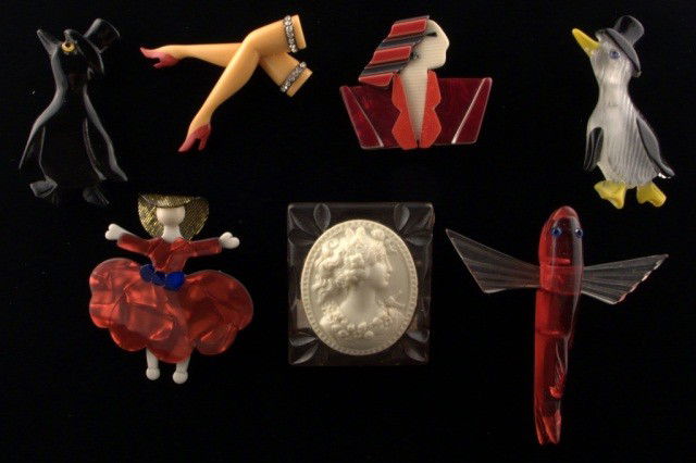 Lea Stein, Paris, & Other Vintage Jewelry *: Comprising Lea Stein Art Deco style bust brooch, a Lea Stein lady in red dress, a lucite and celluloid cameo, a French legs brooch, a red flying fish brooch and two penguin brooches. Penguin 3 inches.