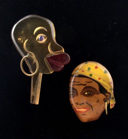 Pirate and Native Bakelite Pins: Both wearing a ring in one ear. Native 3 inches, pirate 2 inches.