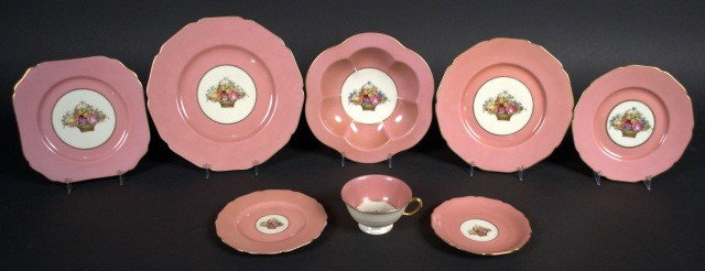 Black Knight Porcelain Dinner Service: Pink border centering a polychrome floral bouquet, comprising six dinner plates, seven luncheon plates, six salad plates, eleven soup plates, five bread plates, eight square dessert plates two cups an