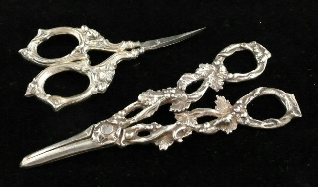 Two Pairs of Sterling Scissors: One, fruit and vine grape shears; the other floral decorated sewing scissors.
