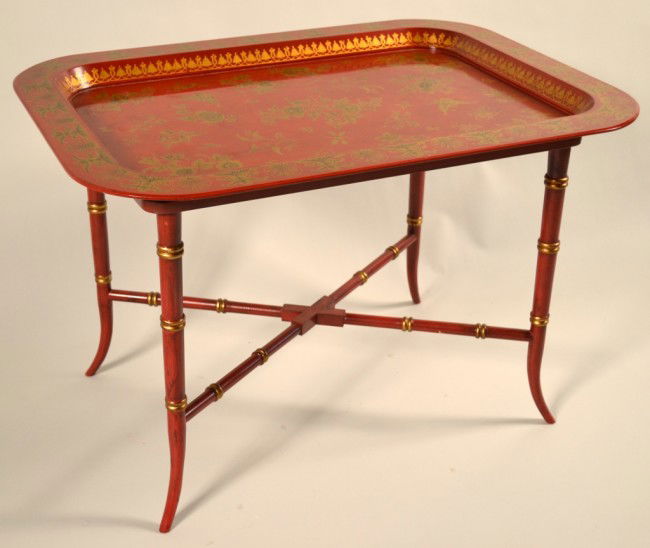 Red Lacquered Tray Table: Papier mache tray with gilt floral decoration, on a separate faux bamboo stand. Height 20 1/2 inches, width 30 1/2 inches, depth 22 inches.