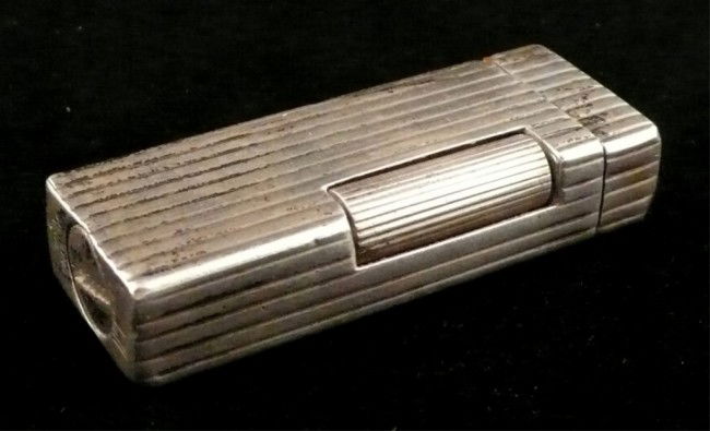 Dunhill Sterling Silver Lighter: Height 2 1/2 inches.