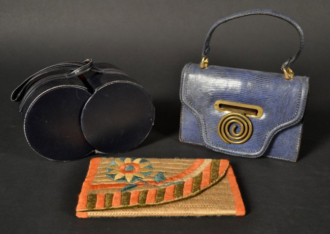 Three Vintage Purses: Navy blue leather bag, blue reptile bag and an embroidered wool clutch.