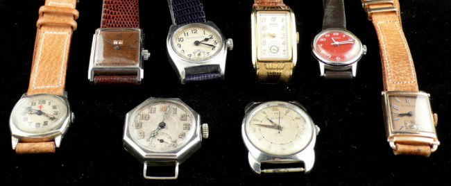 Eight American Wristwatches: Gruen "Drivers" watch; a Gorham retailed by Black Starr and Frost with lizard band; Parker; two Bulovas; Wittnauer; Timex and one other.