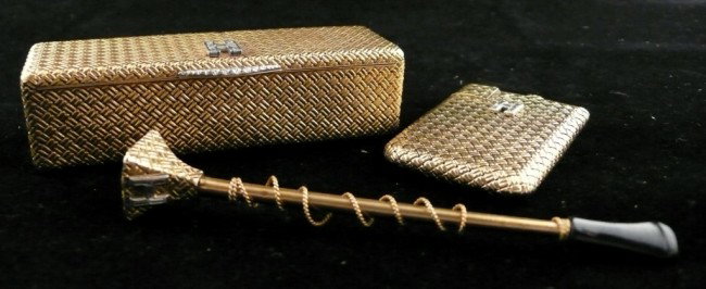 Van Cleef & Arpels Gold & Diamond Purse Suite: 18k yellow gold suite comprising a rectangular box (1 x 3 3/4 x 1 1/8 inches), a cigarette holder and a purse lighter, all with a mounted diamond 'H', the box and lighter signed Van Cleef & Arpels, bo
