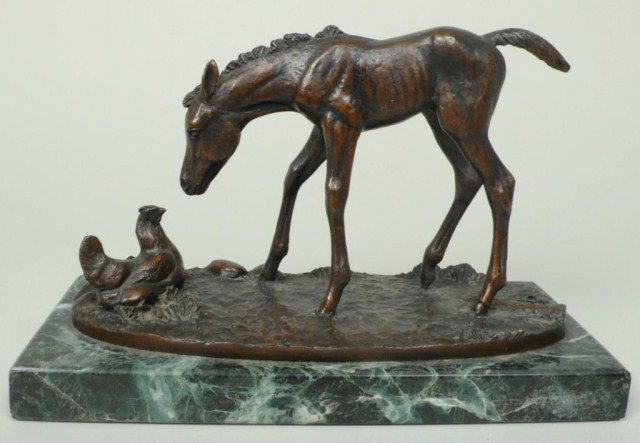French School Colt & Hen: Bronze sculpture of a young colt befriending a nesting hen, unsigned. Mounted on a marble base. Height 5 inches.