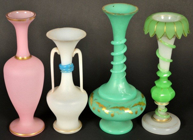 Four Opaline Glass Vases: (1) Pink urn form vase, height12 inches, (2) green genie bottle vase, height 12 1/2 inches, (3) white glass two-handle vase with blue snake applied decoration, height 10 inches, and (4) white and gree