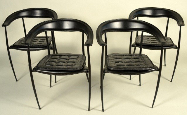 Set of Four Italian Leather Chairs: Each chair with black leather upholstered U shaped back on black patinated tubular metal legs joined by a confoming seat with a padded leather cushion. Height 29 1/2 inches, width 22 inches, depth 20 
