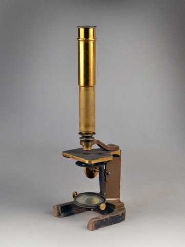 Vintage Brass Microscope: G & L Merz Munchen No. 905. In fitted wood case, with glass slides. Height with stand 13 1/2 inches, scope length 7 1/2 inches, box 8 1/2 x 5 1/2 x 5 1/2 inches.