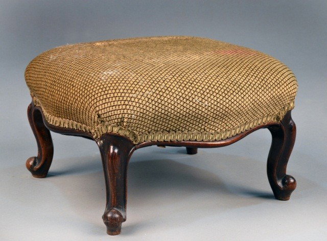 Louis XV Style Walnut Footstool: Shaped rectangular upholstered top on carved cabriole legs. Height 9 inches, width 16 inches, depth 14 inches.