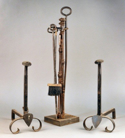 Fireplace Tools and Andirons: Pair of andirons and an assembled set of iron tools. Height of stand 33 1/2 inches. Note: Removed From The Steinway Mansion